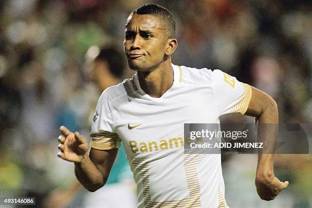 Pumas's Fidel Martinez celebrates after scoring against Leon during their Mexican Apertura tournament football match at the Nou Camp stadium on...