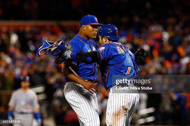 Jeurys Familia and Travis d'Arnaud of the New York Mets reacts celebrate after defeating the Chicago Cubs by a score outfield 4-2 to win game one of...