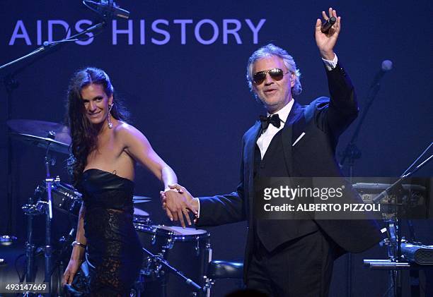 Italian opera singer Andrea Bocelli leaves the stage after performing during the amfAR 21st Annual Cinema Against AIDS on the sidelines of the 67th...