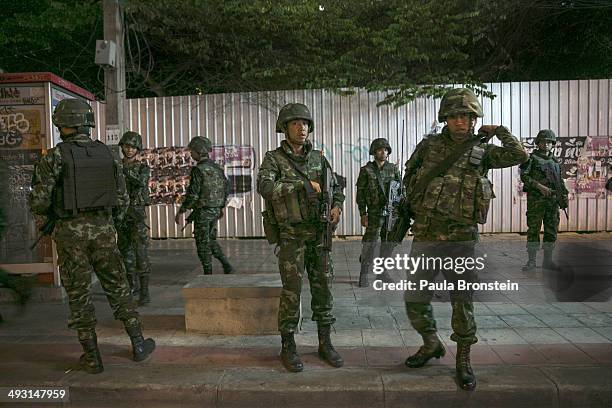 Thai soldiers stand guard after a curfew started at 10pm on May 22, 2014 in Bangkok, Thailand. The Army chief announced in an address to the nation...