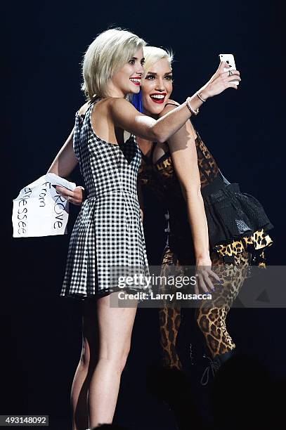 Gwen Stefani poses with a fan during a concert presented by MasterCard exclusively for its cardmembers at Hammerstein Ballroom at the Manhattan...