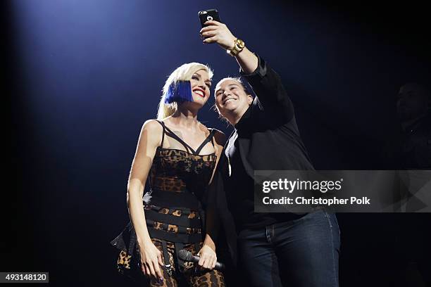 Gwen Stefani poses with a fan during a concert presented by MasterCard exclusively for its cardmembers at Hammerstein Ballroom at the Manhattan...