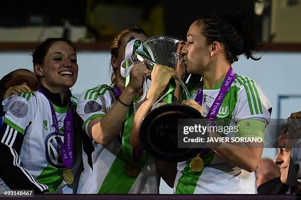 Wolfsburg's captain and midfielder Nadine Kessler kisses the trophy after winning the UEFA Women's Champions League final football match Tyreso FF vs...