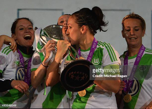 Captain Nadine Kessler of VfL Wolfsburg kisses the trophy in celebration after the UEFA Women's Champions Final match between Tyreso FF and Wolfsburg...