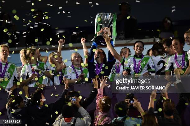 Wolfsburg's goalkeeper Almuth Schult raises the trophy after winning the UEFA Women's Champions League final football match Tyreso FF vs Vfl...