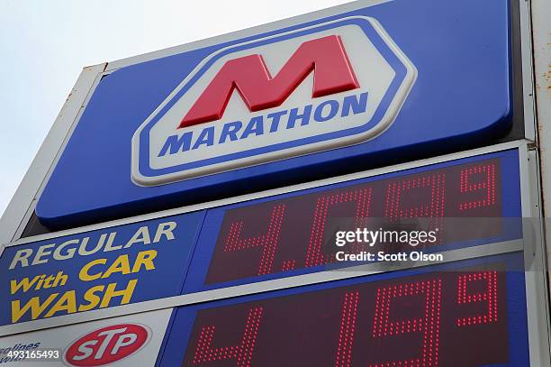 Sign marks the location of a Marathon gas station on May 22, 2014 in Chicago, Illinois. Marathon Petroleum Corp. Has agreed to purchase Hess gasoline...