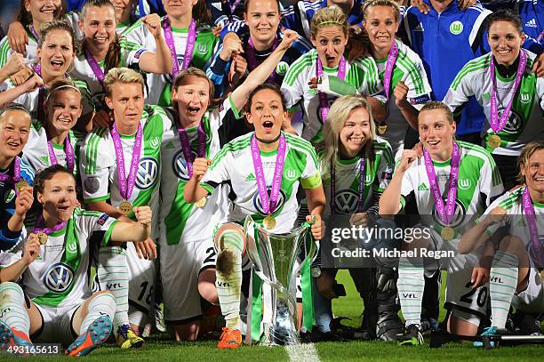 Captain Nadine Kessler of VfL Wolfsburg celebrates alongside team mates with the trophy after the UEFA Women's Champions Final match between Tyreso...