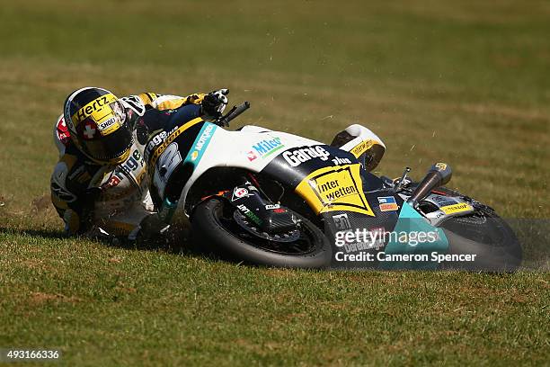 Thomas Luthi of Switzerland crashes during the Moto2 race during the 2015 MotoGP of Australia at Phillip Island Grand Prix Circuit on October 18,...