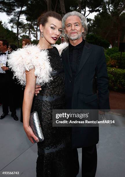 Milla Jovovich and Hermann Buehlbecker attend amfAR's 21st Cinema Against AIDS Gala Presented By WORLDVIEW, BOLD FILMS, And BVLGARI at Hotel du...