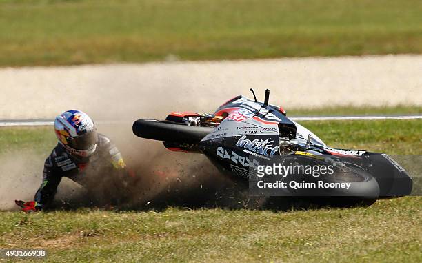 Sandro Cortese of Germany and the Dynavolt Intact GP crashes during the Moto3 Race before the 2015 MotoGP of Australia at Phillip Island Grand Prix...