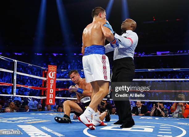 Gennady Golovkin knocks down David Lemieux during their WBA/WBC interim/IBF middleweight title unification bout at Madison Square Garden on October...