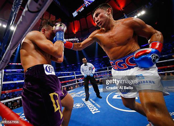 Gennady Golovkin punches David Lemieux during their WBA/WBC interim/IBF middleweight title unification bout at Madison Square Garden on October 17,...