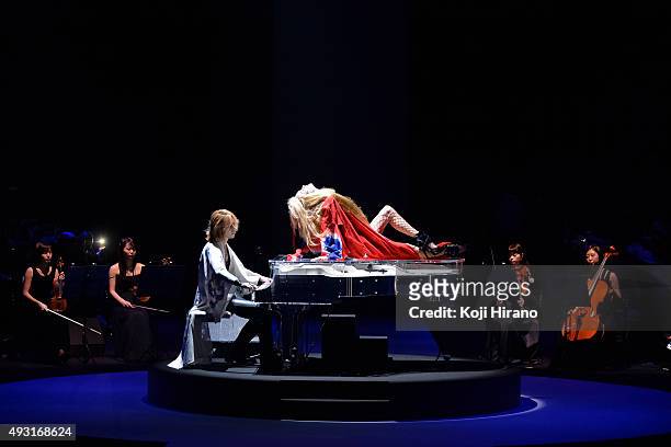 Music band X JAPAN leader and fashion designer YOSHIKI plays piano on the runway during the YOSHIKIMONO show as part of Mercedes Benz Fashion Week...