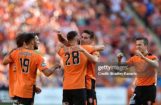 Brandon Borrello of the Roar celebrates scoring a goal with team mates during the round two A-League match between the Brisbane Roar and Central...