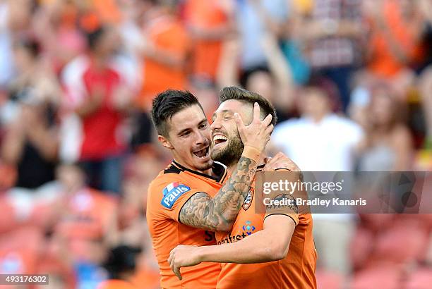 Brandon Borrello of the Roar celebrates scoring a goal with team mate Jamie Maclaren during the round two A-League match between the Brisbane Roar...