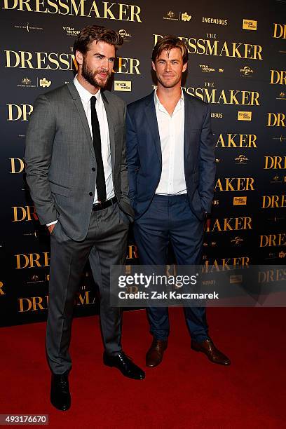 Liam and Chris Hemsworth arrive ahead of the Australian premiere of 'The Dressmaker' on October 18, 2015 in Melbourne, Australia.
