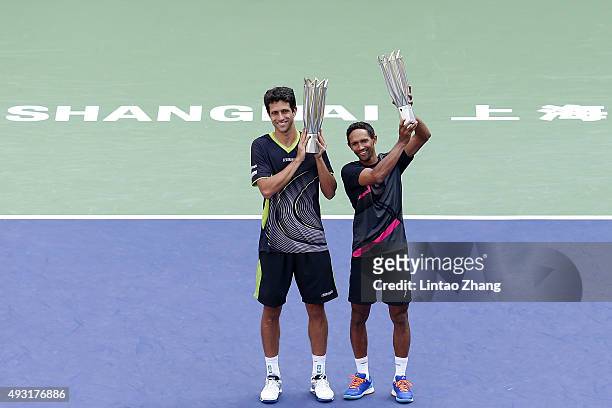 Raven Klaasen of South Africa and Marcelo Melo of Brazil pose with their trophy after winning the Men's doubles final match on day 8 of Shanghai...