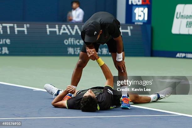 Raven Klaasen of Republic of South Africa and Marcelo Melo of Brazil react after winning the match against Simone Bolelli of Italy and Fabio Fognini...