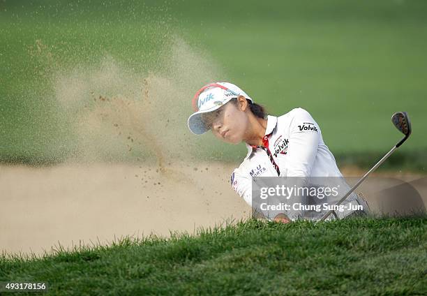 Mi-Hyang Lee of South Korea plays a bunker shot on the 18th hole during round four of the LPGA KEB HanaBank on October 18, 2015 in Incheon, South...