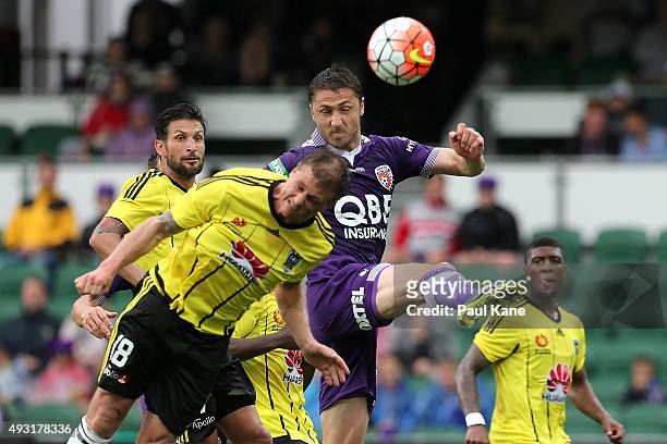 Ben Sigmund of the Phoenix and Dino Djulbic of the Glory contest a corner kick during the round two A-League match between the Perth Glory and...