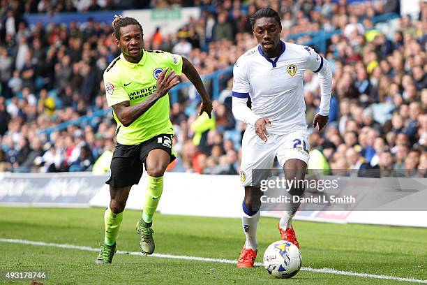 Gaetan Bong of Brighton & Hove Albion FC chases down Jordan Botaka of Leeds United FC during the Sky Bet Championship match between Leeds United and...