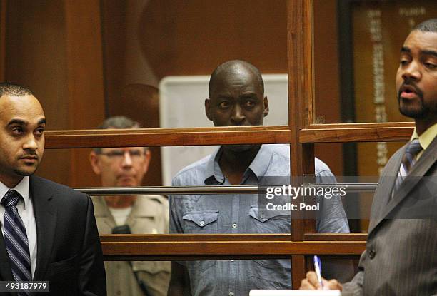 Actor Michael Jace appears in Los Angeles Court with his lawyers Peter Carr and Jason Sias on May 22, 2014 in Los Angeles, California. Jace, a cast...
