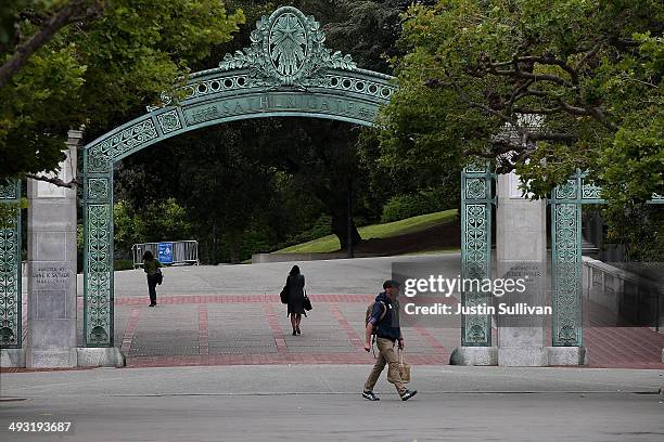 Pedestrians walk by Sather Gate on the UC Berkeley campus on May 22, 2014 in Berkeley, California. According to the Academic Ranking of World...