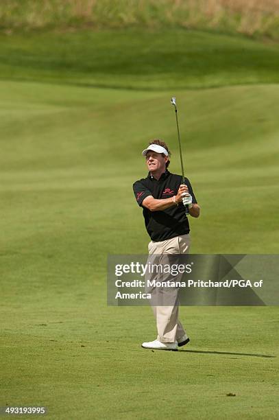 Scott Dunlap of the United States hits a shot on 8 during the 1st Round for the 75th Senior PGA Championship presented by KitchenAid held at Harbor...