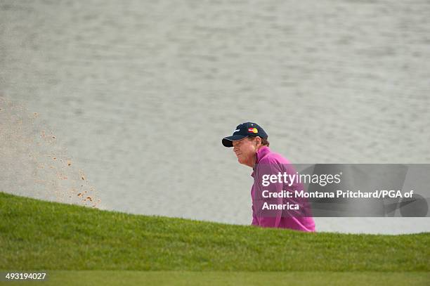 Tom Watson of the United States hits a shot out of a bunker on 5 during the 1st Round for the 75th Senior PGA Championship presented by KitchenAid...