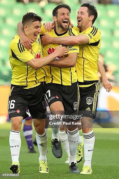 Vince Lia of the Phoenix celebrates with Louis Fenton and Blake Powell of the Phoenix after scoring a goal during the round two A-League match...