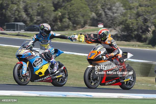 Lorenzo Baldassarri of Italy and Forward Racing greets with Alex Marquez of Spain and Estrella Galicia 0,0 Marc VDS at the end of the Moto2 race...