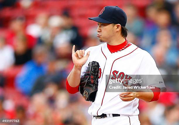 Junichi Tazawa of the Boston Red Sox pitches against the Toronto Blue Jays during the game at Fenway Park on May 22, 2014 in Boston, Massachusetts.