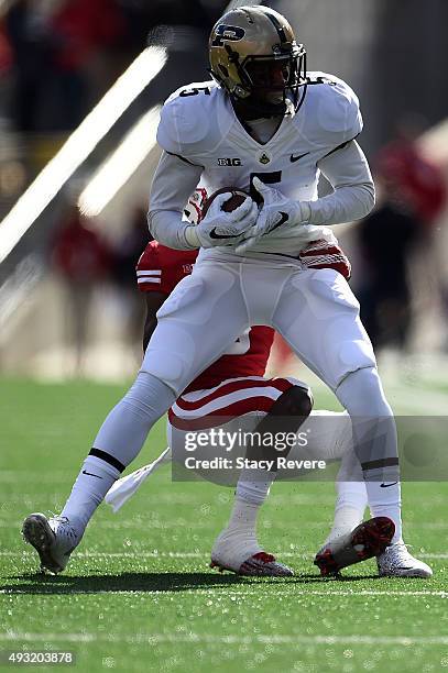 Domonique Young of the Purdue Boilermakers catches a pass in front of Sojourn Shelton of the Wisconsin Badgers during a game at Camp Randall Stadium...