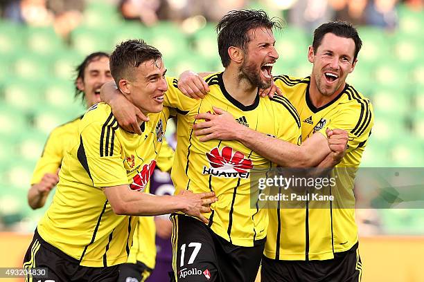 Vince Lia of the Phoenix celebrates with Louis Fenton and Blake Powell of the Phoenix after scoring a goal during the round two A-League match...