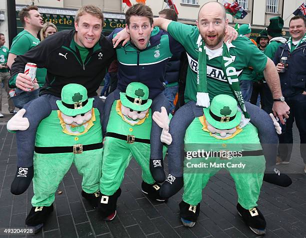 Irish rugby fans pose for a photograph close to the Millennium Stadium where Ireland are playing Argentina in the quarter finals of the Rugby World...