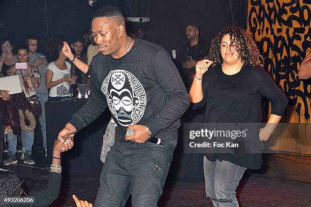 Rap artist Mokobe and young guest perform during the 'Abbe Road 2' Auction Concert Against Bad Housing To Benefit Abbe Pierre Foundation at La Cigale...