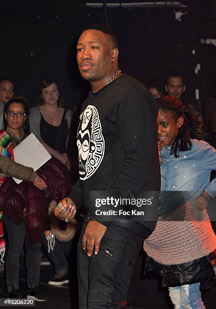 Rap artist Mokobe and young guest perform during the 'Abbe Road 2' Auction Concert Against Bad Housing To Benefit Abbe Pierre Foundation at La Cigale...