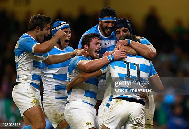 Juan Imhoff of Argentina celebrates with team-mates after scoring his team's fourth try during the 2015 Rugby World Cup Quarter Final match between...