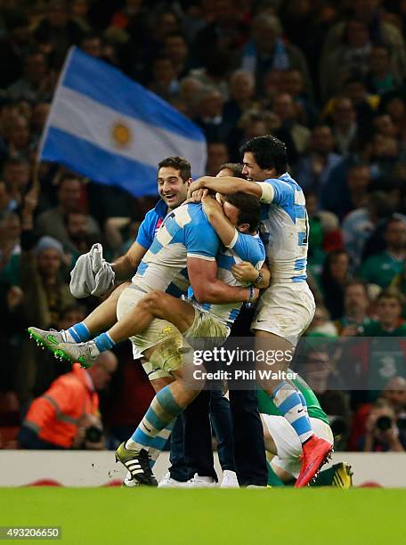 Argentina players celebrate at the final whistle after winning the 2015 Rugby World Cup Quarter Final match between Ireland and Argentina at the...