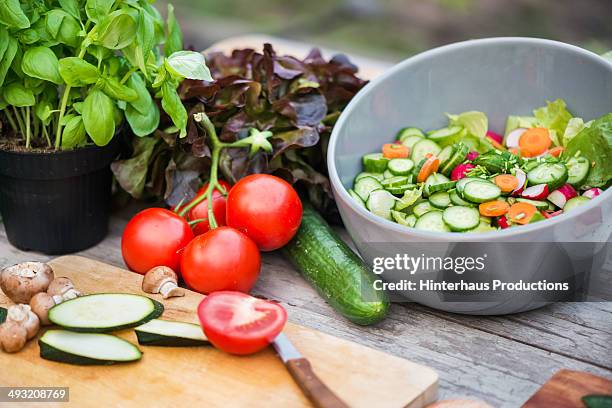 fresh vegetable on vintage garden table - color day productions stockfoto's en -beelden