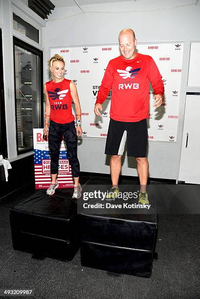 Elisabeth Hasselbeck and Tim Hasselbeck attend the Band-Aid Brand & Team Red, White And Blue Host CrossFit Event For Veteran Heroes on May 22, 2014...