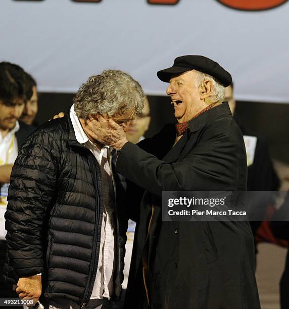 Beppe Grillo, founder of the Movimento 5 Stelle and Nobel Prize-winning writer Dario Fo stand on stage during a political rally at Piazza del Duomo...