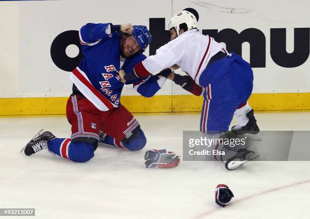 Derek Dorsett of the New York Rangers fights with Brandon Prust of the Montreal Canadiens during the first period in Game Three of the Eastern...