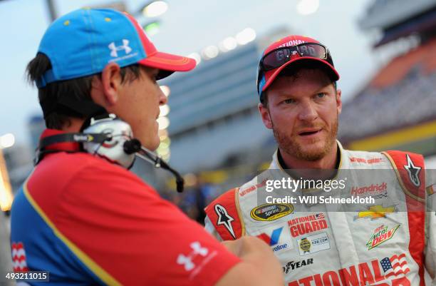 Dale Earnhardt Jr., driver of the National Guard/Superman Chevrolet, stands on the grid with his crew chief, Steve Letarte, during qualifying for the...