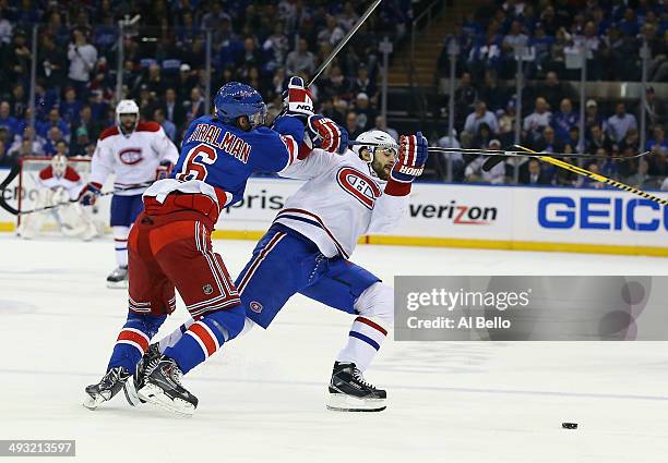 Max Pacioretty of the Montreal Canadiens is knocked off the puck by Anton Stralman of the New York Rangers in Game Three of the Eastern Conference...