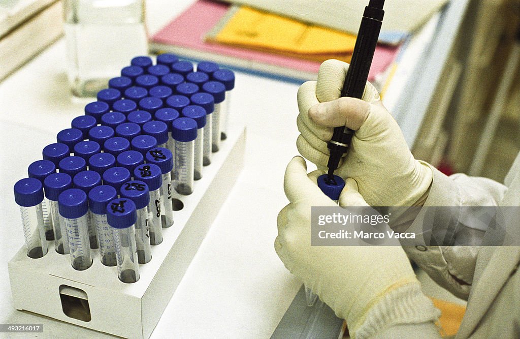 Tecnician marks test tubes