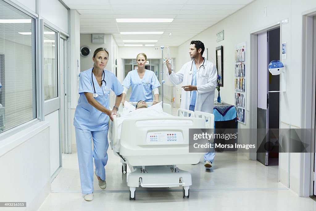 Doctor Rushing Patient In Healthcare Workers Rushing Patient In Hospital High-Res Stock Photo ...