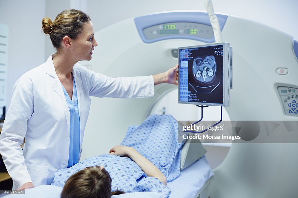 Doctor showing CT scan to patient
