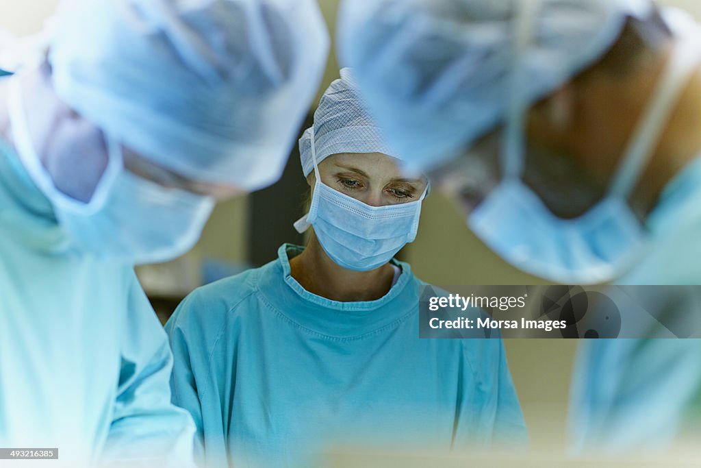 Team of surgeons in operation room