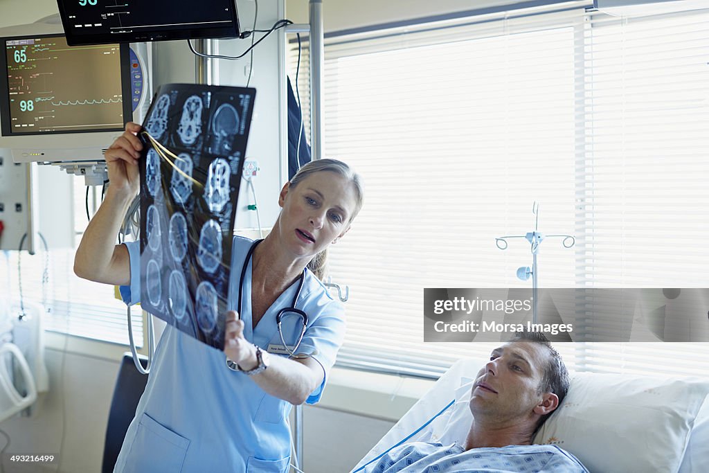 Doctor explaining x-ray to patient